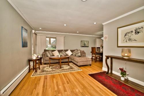a living room with a couch and a table at Madison House in Skokie