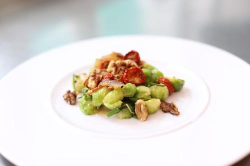 a white plate of food with grapes and nuts at Gastwirtschaft & Hotel Holzinger in Möllersdorf