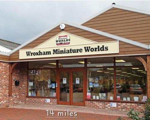a store with a sign that reads wolfman manufacturing worlds at Violetta Hemsby - Holiday home with Games Room in Hemsby