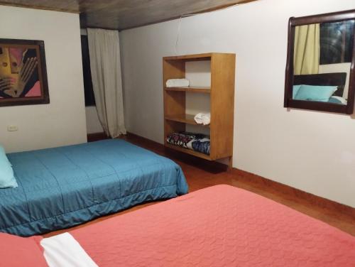Una cama o camas en una habitación de Hotel Rural Don Quijote