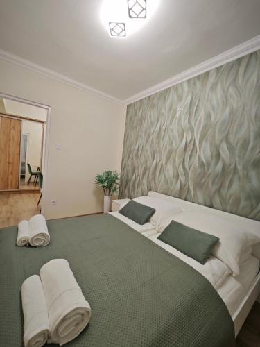 Katil atau katil-katil dalam bilik di Central Greatforest Apartman