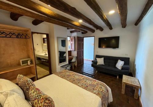 Кровать или кровати в номере Santa Sofia Casa Boutique