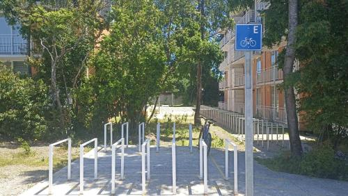 a row of poles with a bike sign on a street at Departamento Condominio Parque Pucón in Pucón