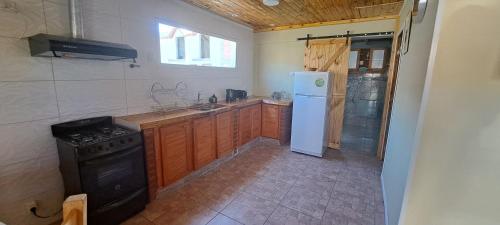 Køkken eller tekøkken på Cabaña La Cruz del Sur