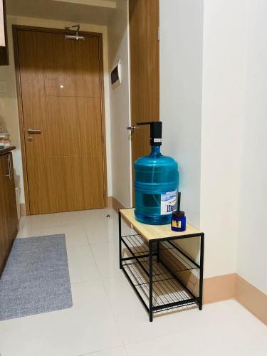 a large blue container sitting on a table in a room at SMDC Shore 3 Residences in Manila