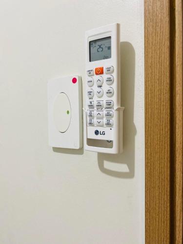 a remote control is attached to a wall at SMDC Shore 3 Residences in Manila