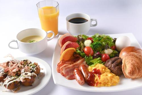 a plate of breakfast food with a cup of coffee at APA Hotel Osaka Higobashi Ekimae in Osaka