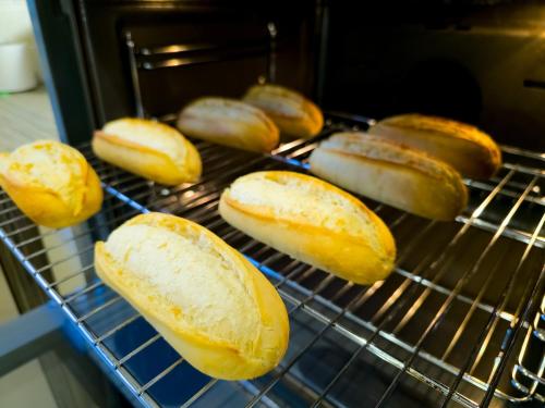a group of loaves of bread cooking in an oven at Lairig Ghru Lodge in Aviemore