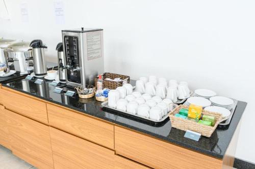 a counter in a kitchen with a coffee maker at Ezza Experience - Beach Flat in Recife