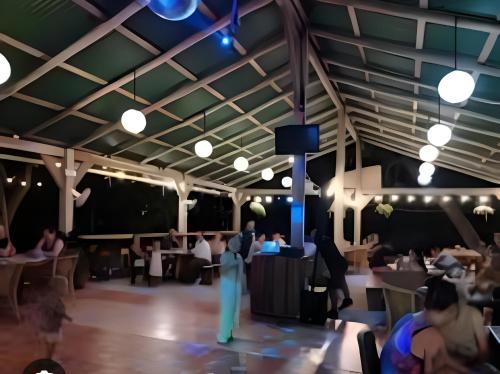 a rendering of a dining room with people eating at Tranquil Tides Costa Rica in Pochote