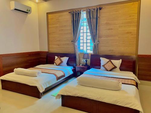 Voodi või voodid majutusasutuse Phuc Hung 2 Hotel toas