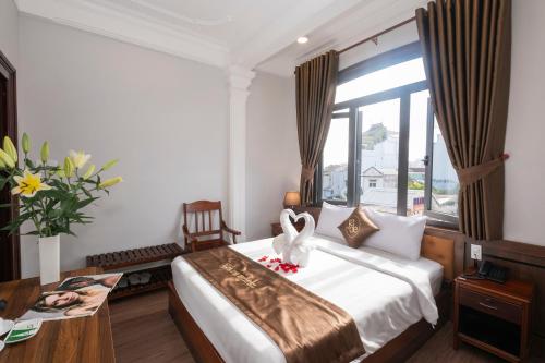 Postel nebo postele na pokoji v ubytování Jade Hotel