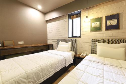 Cama o camas de una habitación en Hotel Gray