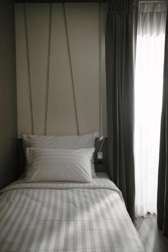 Postel nebo postele na pokoji v ubytování Olive Hotel Bangkok 64