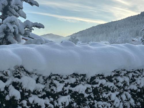a pile of snow on top of a fence at Grossbergblick in Filzmoos