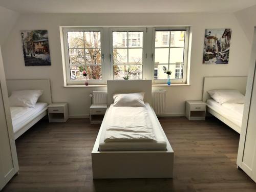 Ένα ή περισσότερα κρεβάτια σε δωμάτιο στο ACR-Accommodations, Gästezimmer, Monteurunterkünfte
