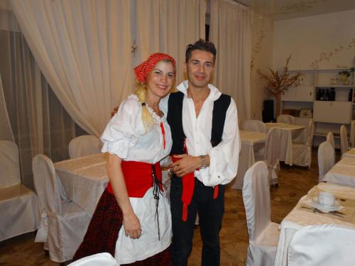 a man and a woman posing for a picture at a wedding at Hotel Heaven in Rimini