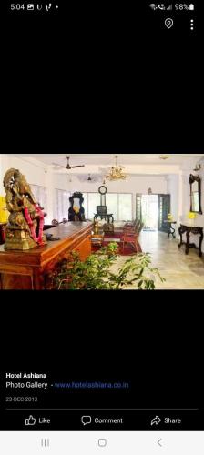 a picture of a large living room with at Hotel Ashiana in Siliguri