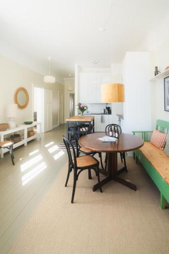 a kitchen and dining room with a table and chairs at Postmaster's Chamber in Ekenäs