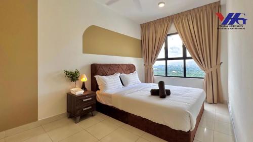 a bedroom with a bed and a large window at Arena Residence KLIA Sepang With Netflix in Sepang