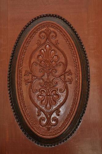 a brown plate with a design on a table at Casa Manuel Espregueira e Oliveira in Viana do Castelo