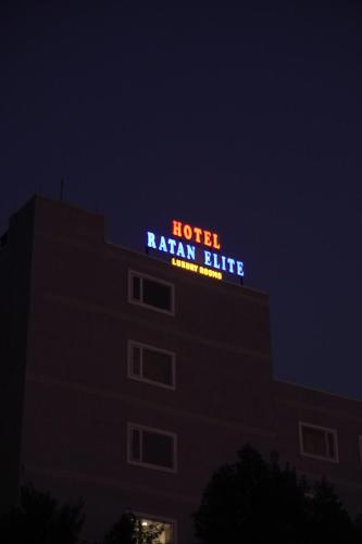 a hotel raisan blue sign on top of a building at Hotel Ratan Elite in Bijainagar