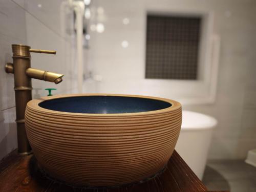a bathroom with a sink with a faucet at FuqianRED in Tainan
