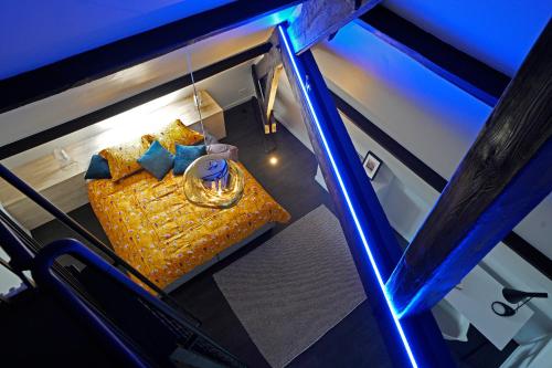 an overhead view of a bed with a wedding ring at B&B Het Havenhuis in Bruges