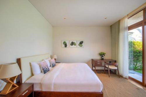 Ένα ή περισσότερα κρεβάτια σε δωμάτιο στο Sunny Beach Villa