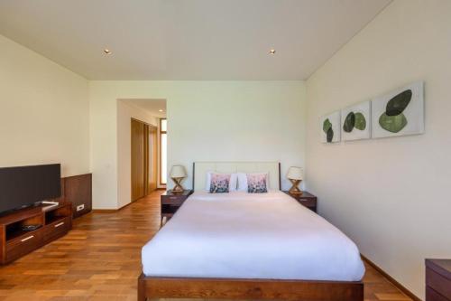 Ένα ή περισσότερα κρεβάτια σε δωμάτιο στο Sunny Beach Villa