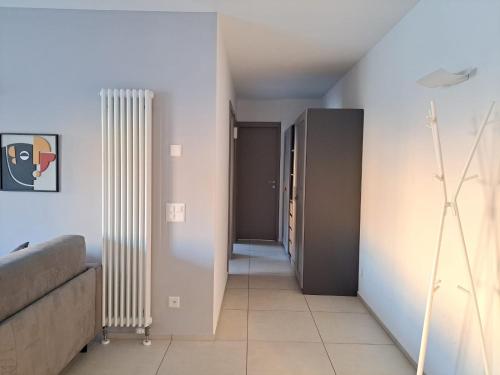 a hallway with two white radiators in a room at Urban Residence by Quokka 360 - Apartments with parking in Lugano in Aldesago
