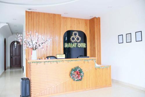 a lobby with a counter and a sign that reads back off at Otel Hotel Dalat in Da Lat