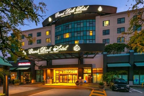 a building with a sign on the front of it at Grand Park Hotel Vancouver Airport, an Ascend Collection Hotel in Richmond