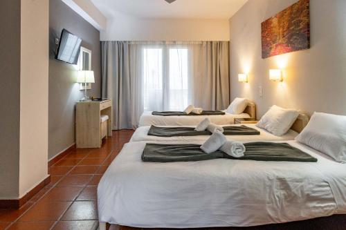 Postel nebo postele na pokoji v ubytování Scala Hotel