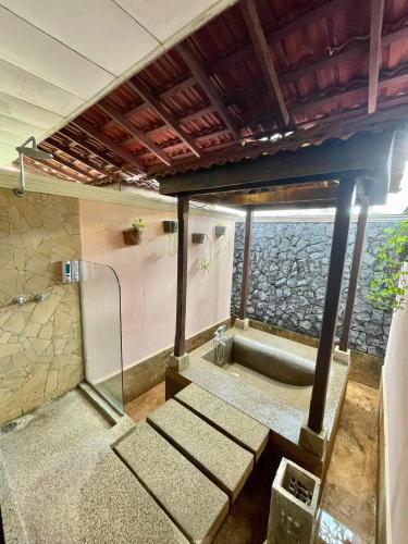 a room with a shower with a bench in it at Holiday Villa Resort & Beachclub Langkawi in Pantai Cenang