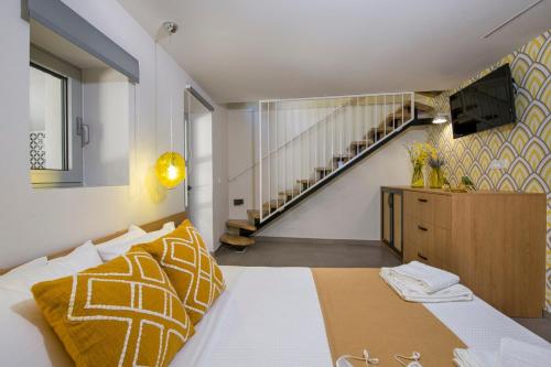 a bedroom with a bed and a staircase at Casa Di Camomilla in countryside in Chania Town