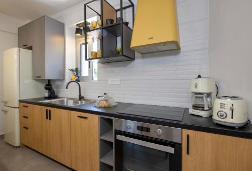 a kitchen with a sink and a counter top at Casa Di Camomilla in countryside in Chania Town