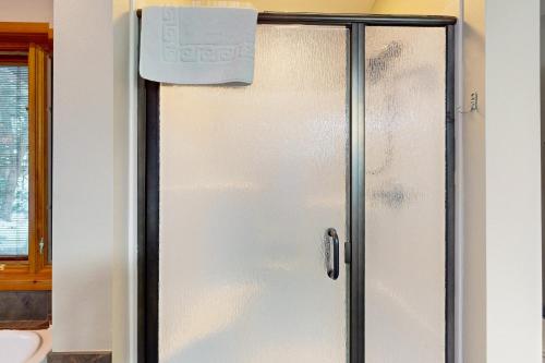a refrigerator in a kitchen with a sign on it at Good Time Inn in Lake Tomahawk