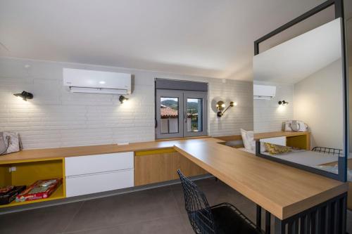 a kitchen with a wooden counter top in a room at Casa Di Camomilla in countryside in Chania Town