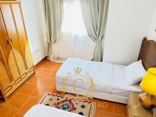 a living room with a bed and a window at Casa Do Cairo-Sharm Alsheikh in Sharm El Sheikh