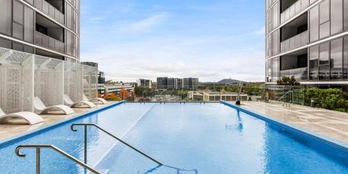 a large swimming pool on top of a building at Urban Retreat - 2 BDR 2 BTH Apartment in Phillip