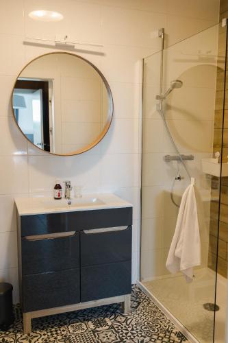 a bathroom with a sink and a shower at Villa Monica Apartamenty in Szczyrk