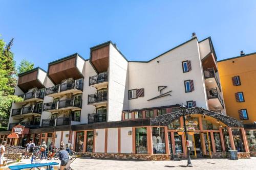 a large building with people in front of it at Lift House Lodge, Downtown Vail Lionshead Village Studio Condo in Vail