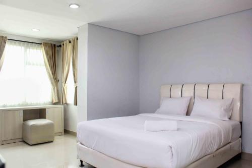 Katil atau katil-katil dalam bilik di Cozy and Spacious Studio at The Enviro Apartment By Travelio