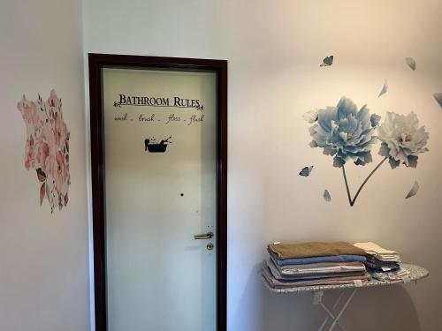 a door to a room with a sign on the wall at Friends and Family in Brescia