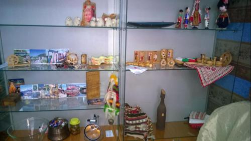 a shelf filled with lots of items in a room at Hostel Alex 1 in Sofia
