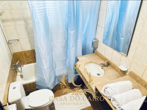 a bathroom with a toilet and a sink and a mirror at Casa Do Cairo-Sharm Alsheikh in Sharm El Sheikh