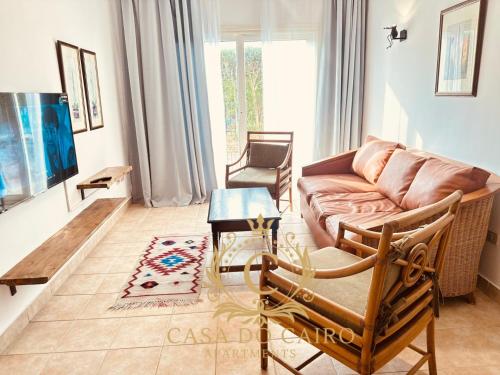 a living room with a couch and a table at Casa Do Cairo-Sharm Alsheikh in Sharm El Sheikh
