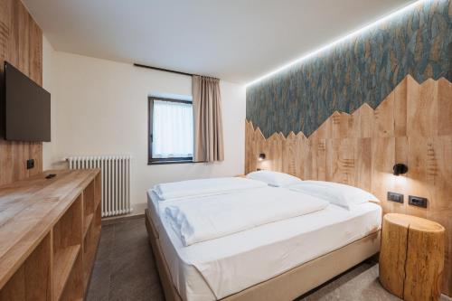 Postel nebo postele na pokoji v ubytování Residence Piz Aot