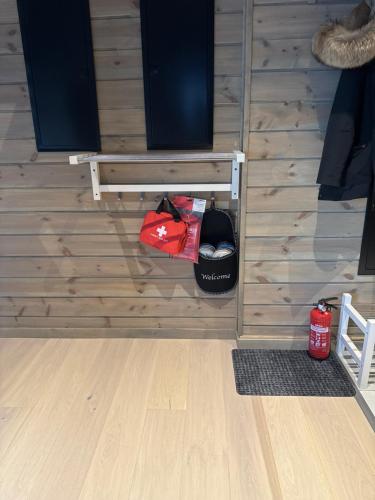 a room with a wooden wall with a speaker at Idre himmelfjäll ski in out in Idrefjäll